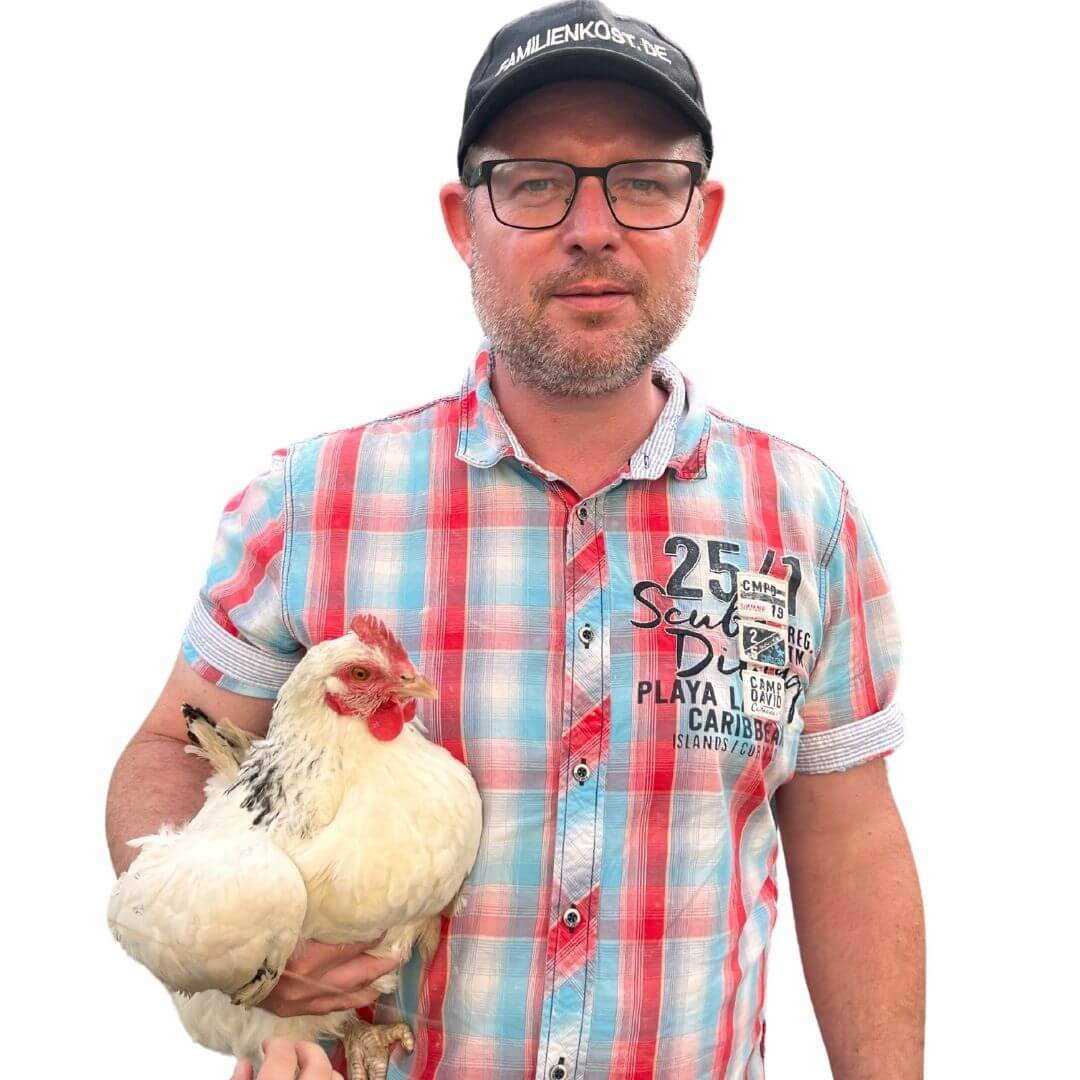 Mann mit Huhn